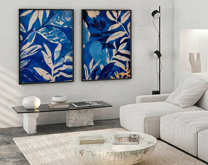Blue botanical art prints set displayed in contemporary living room with minimalist decor