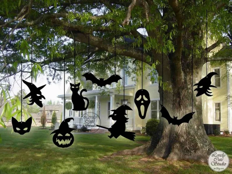 Hanging Halloween silhouettes including bats, witches, and cats for outdoor decoration