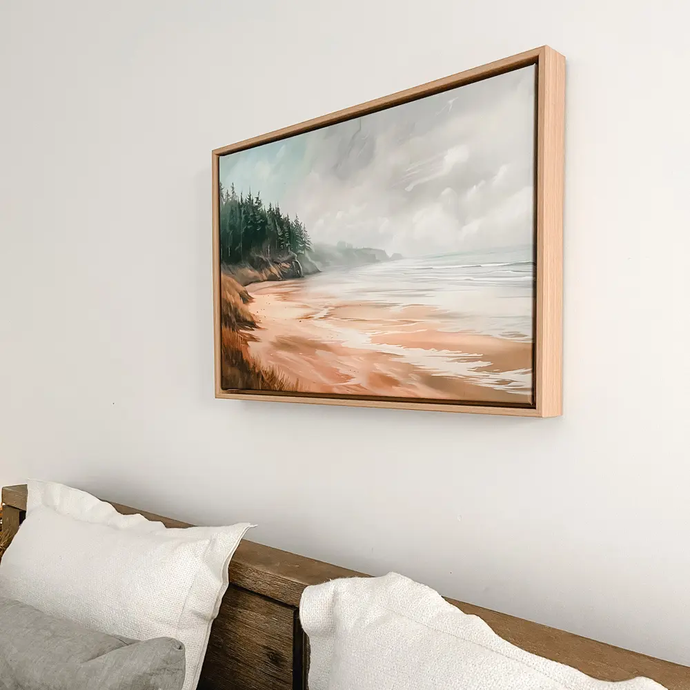 Coastal wall art featuring a serene beach and pine trees above a beige sofa