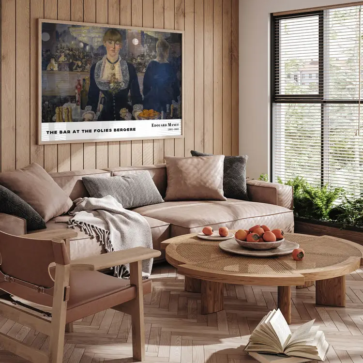 Classic art print by Manet displayed above beige sofa in a modern living room