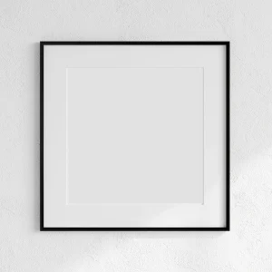 Black aluminium picture frame with mat board against a textured wall