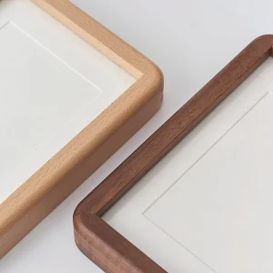 Close-up comparison of Beechwood and Walnut solid wood picture frames