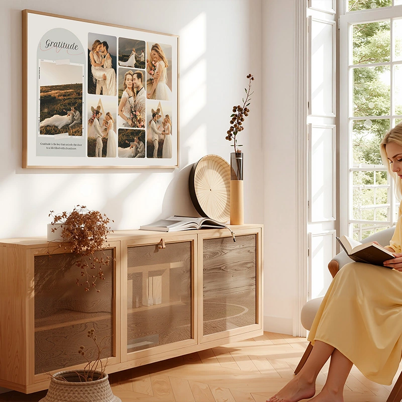 Warm, welcoming framed art wall above a wooden sideboard in a bright living room
