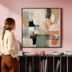Large abstract art framed and displayed on a pink feature wall
