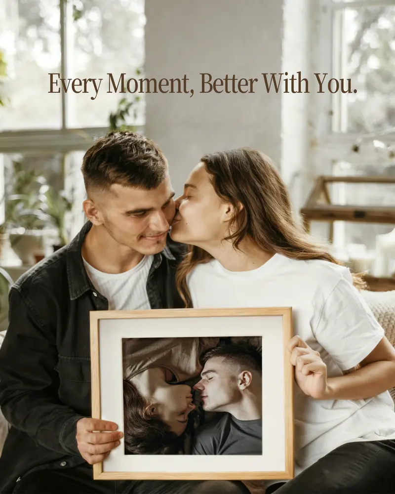 Couple holding a wooden photo frame with a romantic portrait, perfect for anniversary gift ideas