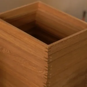 close-up of timber frame corner with mortise and tenon reinforcement