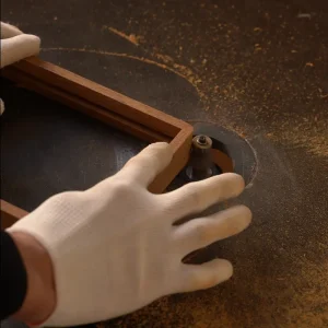 shaping a wooden picture frame using a router machine