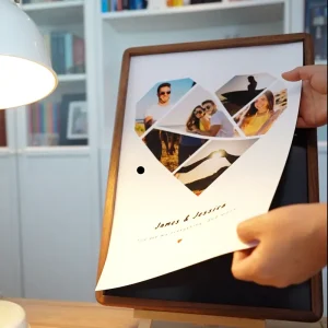Changing a heart-shaped photo collage print on a VeeArt magnetic frame