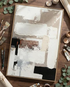 Artist applying texture to a textured wall art.