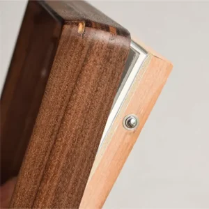 Close-up of the stainless steel ball detent mechanism on the Veeart wood frame for tool-free closure.