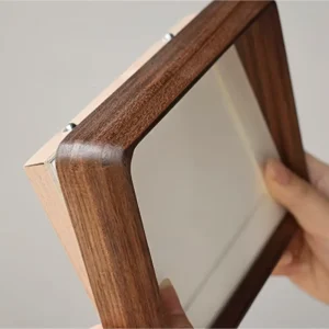 Front view of Veeart walnut frame featuring rounded corners and high-definition acrylic panel.