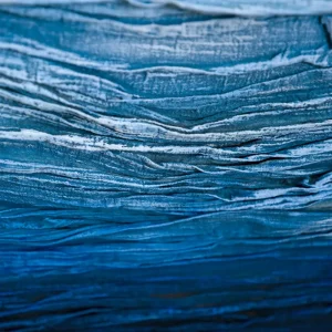 Close up of layered textile art australia fabric texture in deep blue
