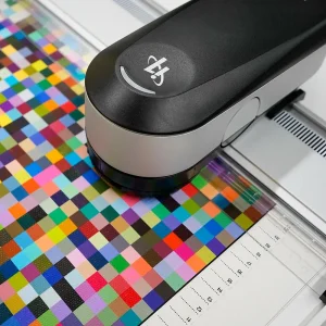 Professional colour calibration tool scanning a test chart to ensure accurate fine art printing.