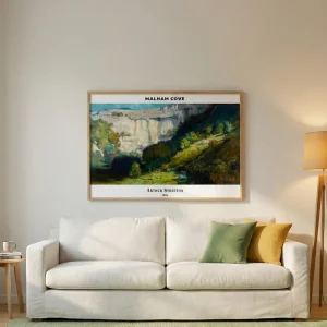 Horizontal landscape art by Arthur Streeton hanging 15-20cm above a light beige sofa in a cozy living room.