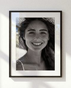 Modern black and white portrait photography in slim black aluminium frame.