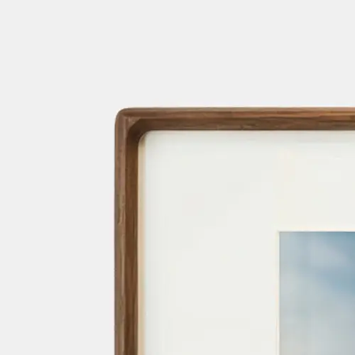 Solid Sapele timber collage photo frame with a bevelled architectural edge and shadow line.