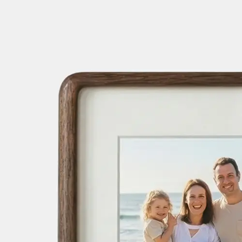 Curved Walnut solid timber collage photo frame with an organic pill-shaped profile and rounded edges.