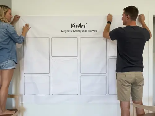 Installing gallery wall frames with hanging guide.