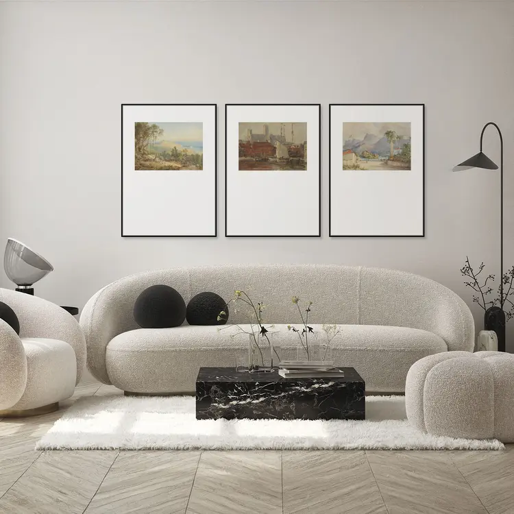 Symmetrical gallery wall frame grid above sofa.